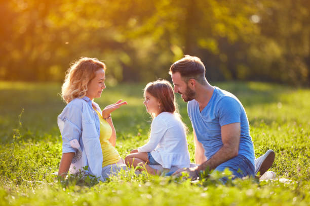 istock Mom with daughter and husband together 664410842