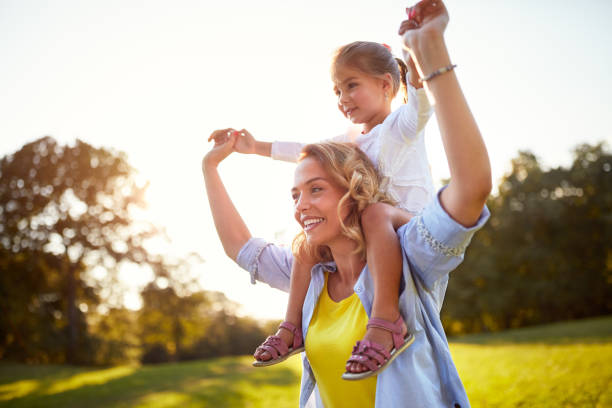 istock Mother having fun with daughter outdoor 664413514