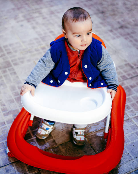 istock Cute baby in baby walker 664414850