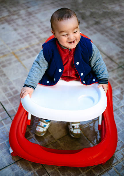 istock Cute baby in baby walker 664414866