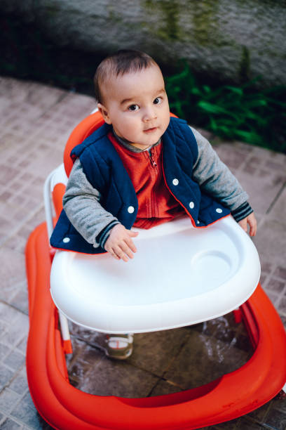 istock Cute baby in baby walker 664416198