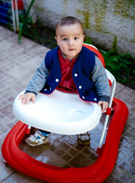 istock Cute baby in baby walker 664417122