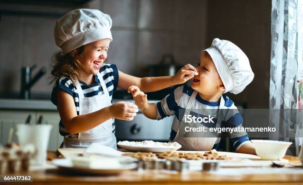 Happy Family Funny Kids Bake Cookies In Kitchen Stock Photo - Download Image Now - Baking, Child, Christmas