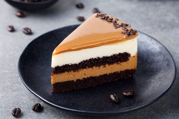 istock Caramel cake, mousse dessert on a plate. Grey stone background 664417648
