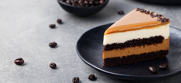 istock Caramel cake, mousse dessert on a plate. Grey stone background 664418064