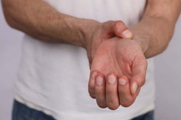 istock Man hands checking heart rate pulse on wrist close up 664418166