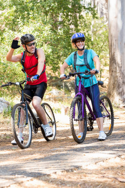 istock Senior couple standing with their bike 664421244