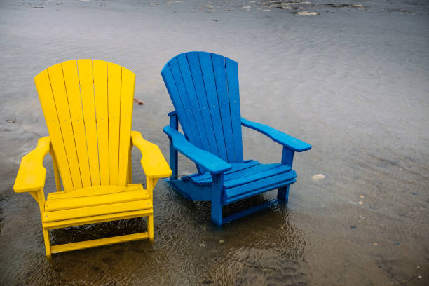 istock Stormy Lake Beach with outdoor Chairs 664424576
