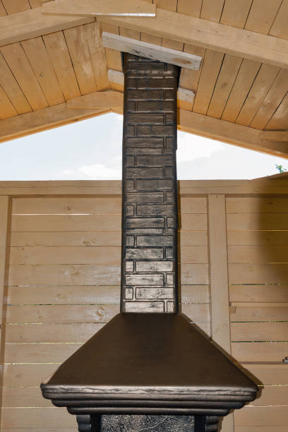 istock Newly built stone grill in a wooden pavilion 664427292