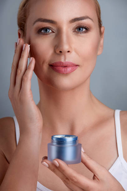 istock woman uses the cream to rejuvenate 664431230