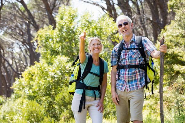istock Senior couple standing with their stick 664431308