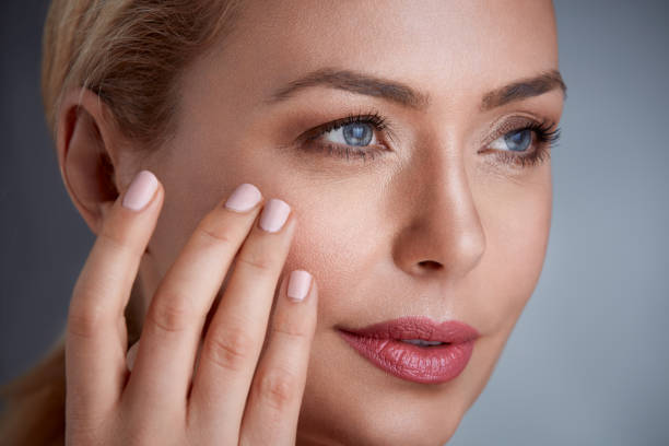 istock woman touching her skin 664431352