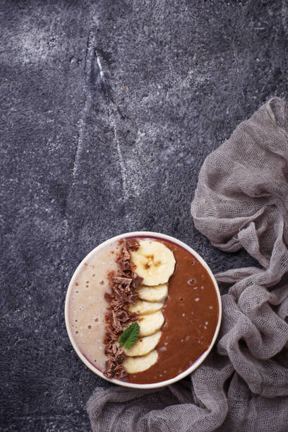 istock Banana and chocolate smoothie bowl 664431856