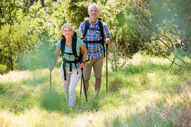 istock Senior couple standing with their stick 664434368