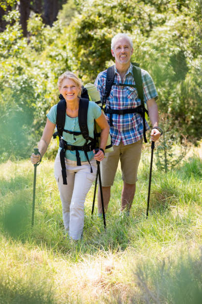 istock Senior couple standing with their stick 664434522