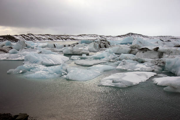 istock Blue icebergs floating on a dark sea 664434732