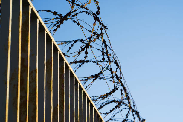 istock Fence with barbed wire. focus with shallow depth of field. 664436656