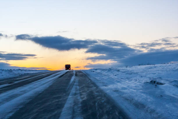 istock A lonely trucker driving in the blizzard at the dusk 664442454