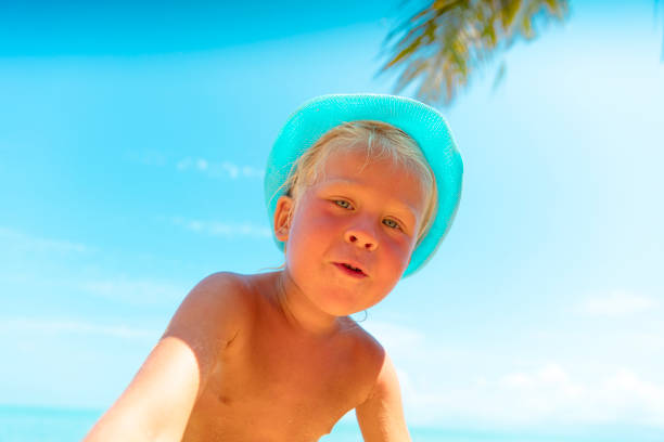 Baby playing in tropical beach