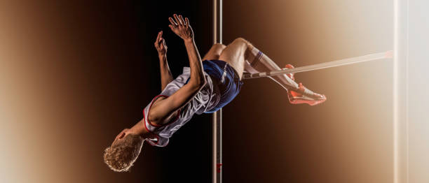 istock Male athlete performing a high jump 664446884