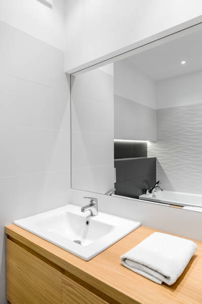 istock New bathroom with wooden cabinet 664451100