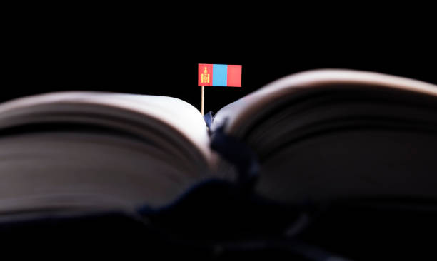Mongolian flag in the middle of the book. Knowledge and education concept. stock photo