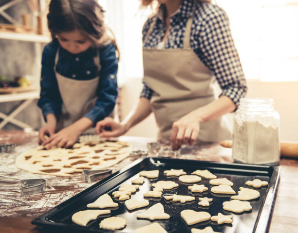 istock Mom and daughter baking 664451236
