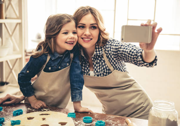 istock Mom and daughter baking 664451546