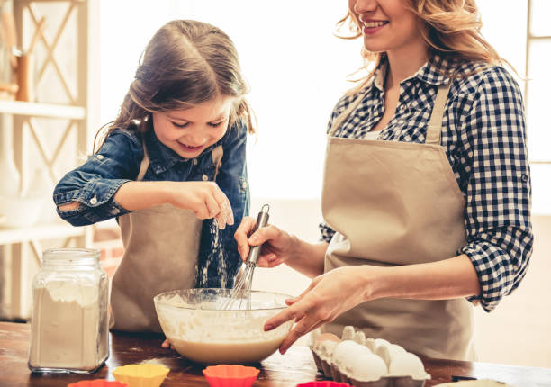 istock Mom and daughter baking 664451824