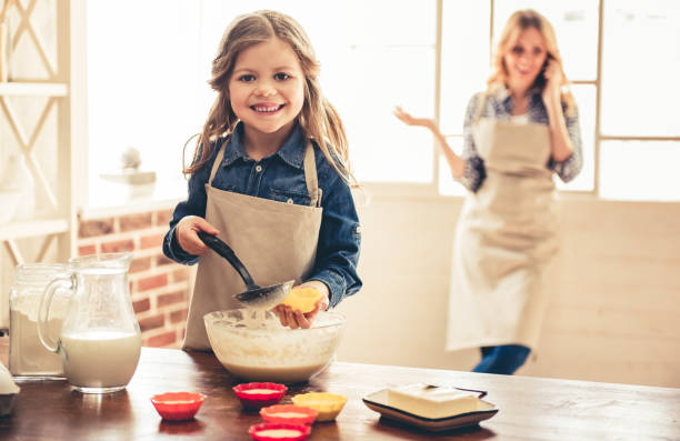 istock Mom and daughter baking 664454388