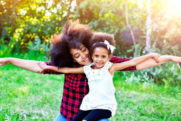 istock Mother and daughter flying 664455192