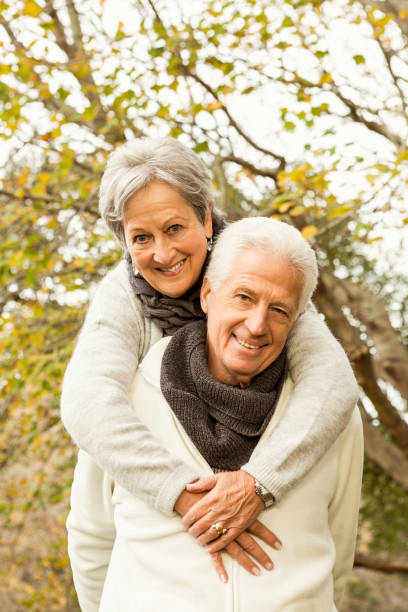 istock Senior couple in the park 664455840