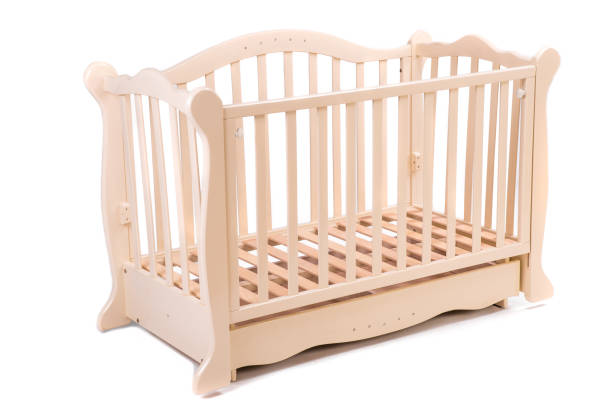 istock baby bed wooden on a white background 664462494