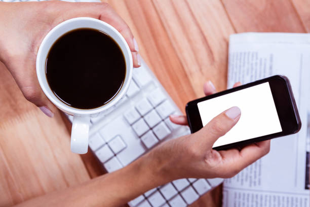 istock Businesswoman using her smartphone on desk 664471152