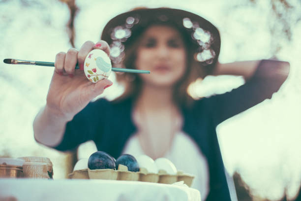istock Close-up of woman showing decoupage egg 664474078