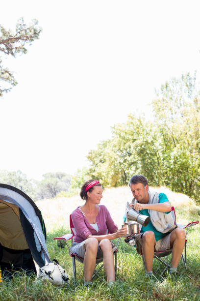 istock senior couple serving a cup of coffee 664486902