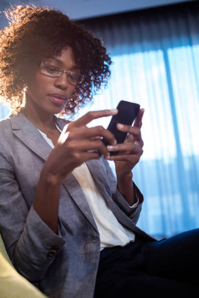 istock Businesswoman using a smartphone 664498490
