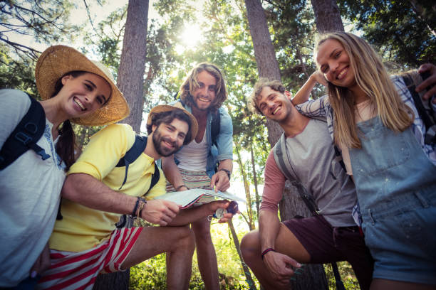 istock Group of friends standing together in forest 664510854