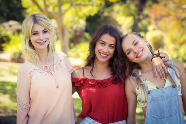 istock Friends standing together in park 664514374