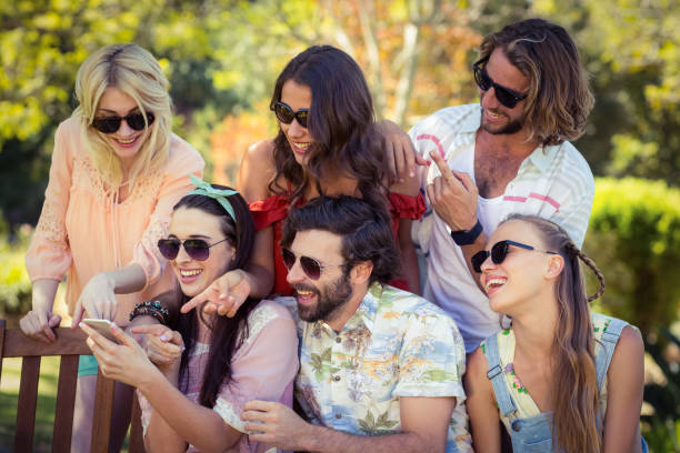 istock Friends looking at mobile phone 664515226