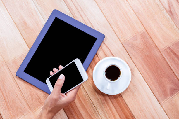 istock Businesswoman using her smartphone on desk 664515372