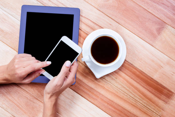 istock Businesswoman using her smartphone on desk 664517850