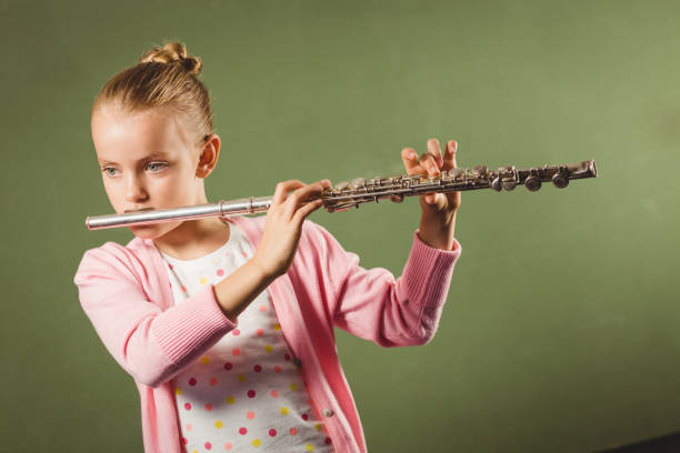 istock Girl playing the flute 664520994