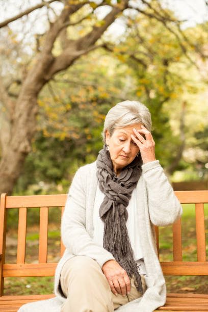 istock Senior woman in the park 664521590