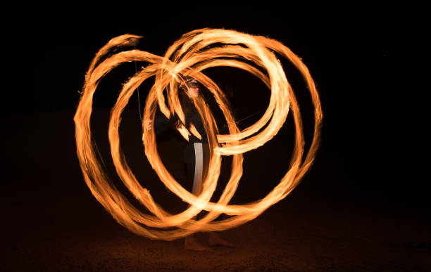 istock Dancer with flaming fire pois after dark. 664521962