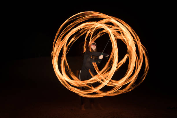 istock Dancer with flaming fire pois after dark. 664522002