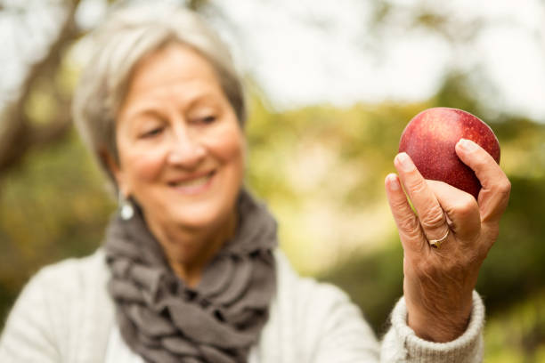 istock Senior woman in the park 664522212