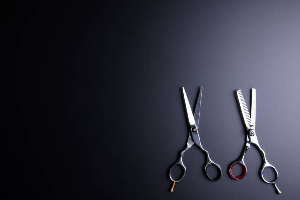 istock Stylish Professional Barber Scissors, Hair Cutting and Thinning Scissors on black background. Hairdresser salon concept, Hairdressing Set. Haircut accessories. Copy space image, flat lay. 664525022