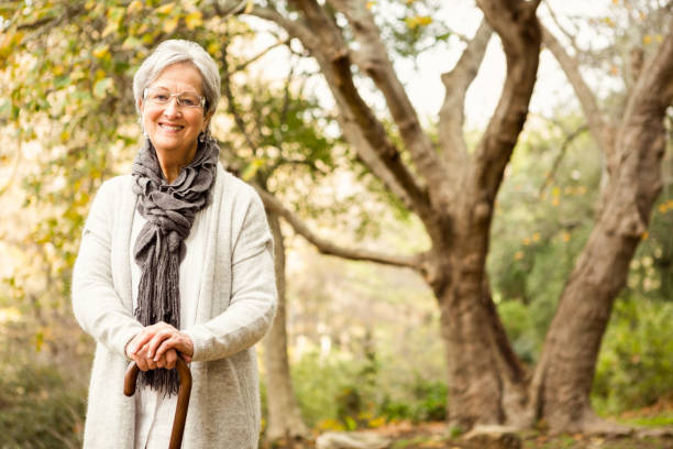 istock Senior woman in the park 664526384
