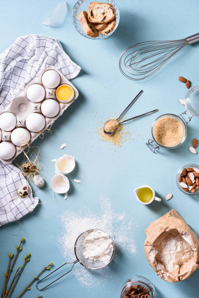 istock Bakery background, baking ingredients over blue kitchen countertop. Flour, egg, sugar and almond nuts. 664529264